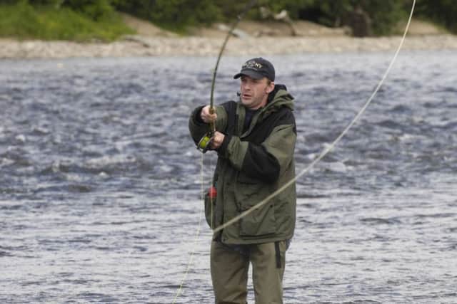 While fishermen try to lure a salmon to bite, vishing scammers use even more sophisticated methods to ensnare unwary consumers. Picture: Donald MacLeod
