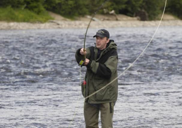 While fishermen try to lure a salmon to bite, vishing scammers use even more sophisticated methods to ensnare unwary consumers. Picture: Donald MacLeod