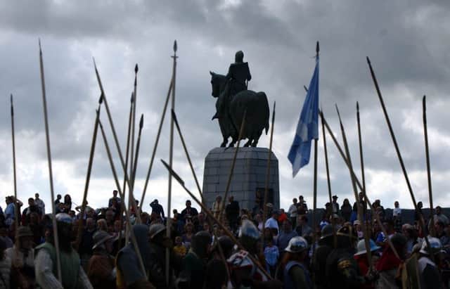 Bannockburn recreation with Robert The Bruce statue in the background. Picture: Robert Perry