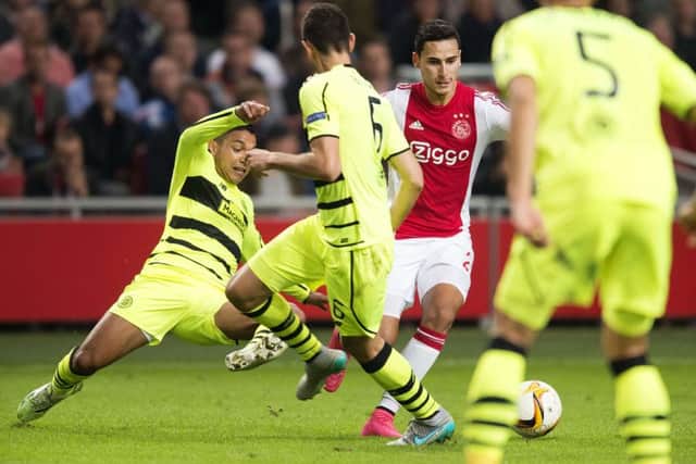 Ajax's Anwar El Ghazi is brought down by Emilio Izaguirre. The Celtic player was shown a second red card. Picture: AFP/Getty