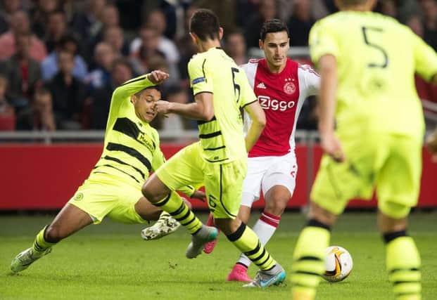 Ajax's Anwar El Ghazi is brought down by Emilio Izaguirre. The Celtic player was shown a second red card. Picture: AFP/Getty