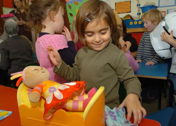 Young Alyssa Arkotxa-Lakha plays with an In The Night Garden toy. Picture: TSPL