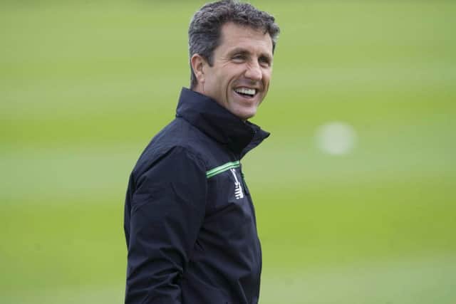 John Collins is all smiles at training after Celtic returned home to Lennoxtown. Picture: SNS