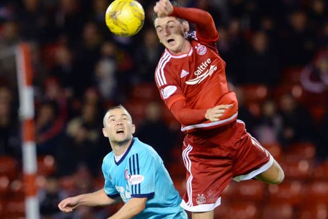 Aberdeen's Kenny McLean (right) goes in for the aerial challenge against Hamilton's Grant Gillespie. Picture: SNS Group