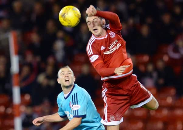 Aberdeen's Kenny McLean (right) goes in for the aerial challenge against Hamilton's Grant Gillespie. Picture: SNS Group