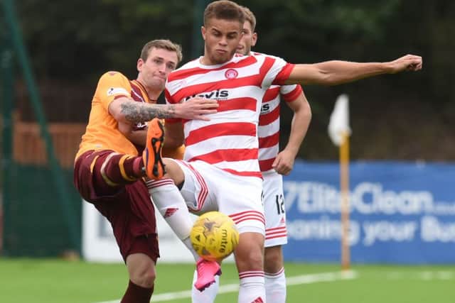 Motherwell's Josh Law (left) challenges Carlton Morris. Picture: SNS Group