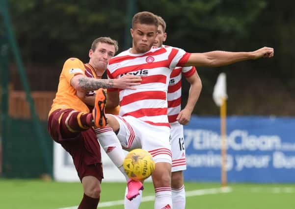 Motherwell's Josh Law (left) challenges Carlton Morris. Picture: SNS Group