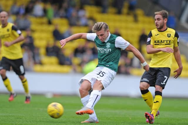 Hibs' Jason Cummings (centre) and Scott Pittman of Livingston. Picture:   Neil Hanna