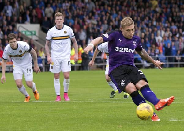Rangers' Martyn Waghorn scores from the penalty spot at Dumbarton. Picture: PA