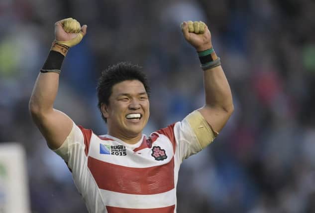 Japan's Harumichi Tatekawa celebrates winning the Pool B match of the 2015 Rugby World Cup between South Africa and Japan. Picture: AFP/Getty