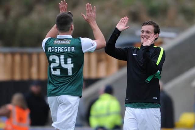Hibs matchwinner Liam Henderson celebrates with teammate Darren McGregor at fulltime in Livingston.  Picture: Neil Hanna