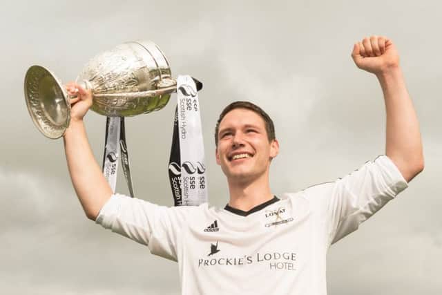 Lovat captain Daniel Grieve lifts the 2015 Camanachd Cup after his sides 21 win against Kyles Athletic  in Oban. Picture: Neil Paterson