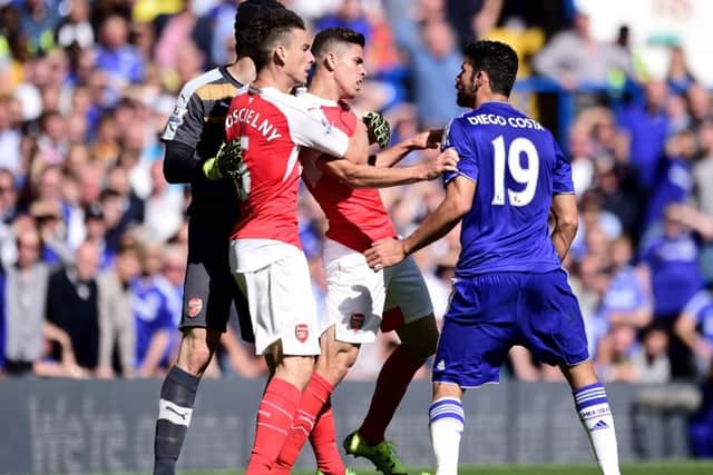 Chelsea striker Diego Costa (right) and Gabriel Paulista (centre) clash at Stamford Bridge. Picture: PA