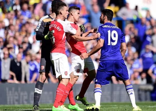 Chelsea striker Diego Costa (right) and Gabriel Paulista (centre) clash at Stamford Bridge. Picture: PA