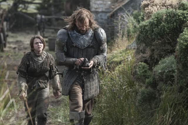 Maisie Williams as Arya Stark and Rory McCann as The Hound in season four of Game of Thrones