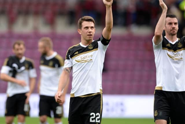 Aberdeen's Ryan Jack salutes the travelling support at full time at Tynecastle. Picture: SNS Group