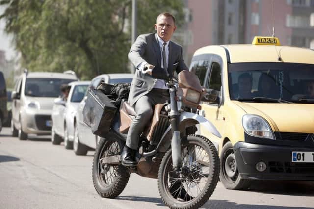 Daniel Craig as James Bond in Skyfall. He will resume the role in Spectre, which is released on October 26