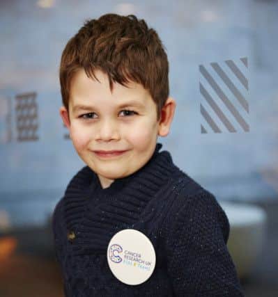 The primary two pupil is the poster boy for Cancer Research initiative