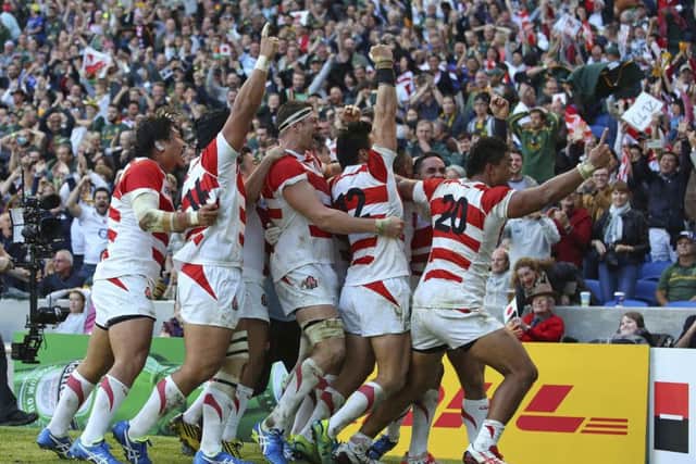 Japan celebrate the 34-32 win against the Springboks on Saturday, regarded as the biggest upset in Rugby World Cup history. Picture: Gareth Fuller/PA via AP