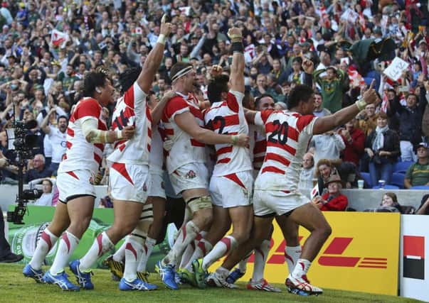 Japan celebrate the 34-32 win against the Springboks on Saturday, regarded as the biggest upset in Rugby World Cup history.  Picture: Gareth Fuller/PA via AP