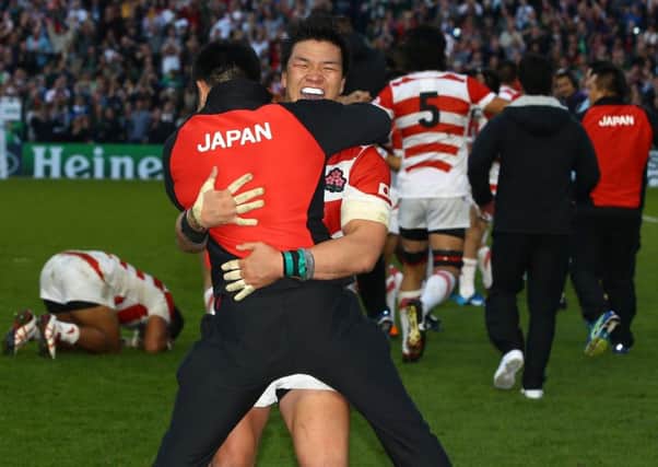 Japanese players celebrate their win against South Africa. Picture: Getty