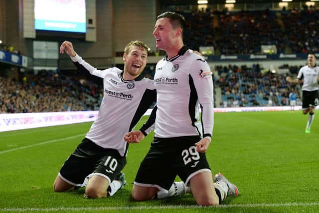 David Wotherspoon and Michael O'Halloran (right) celebrate after the latter had netted St Johnstone's third. Picture: SNS