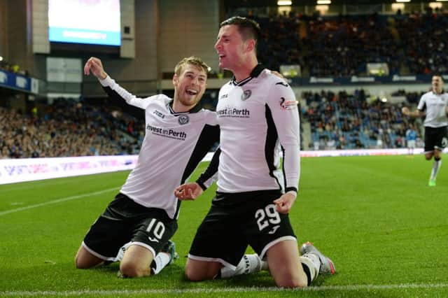 David Wotherspoon and
 Michael O'Halloran (right) celebrate after the latter had netted St Johnstone's third. Picture: SNS