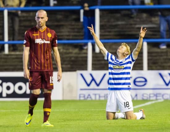 Morton's Alex Samuel (right) celebrates having opened the scoring. Picture: SNS