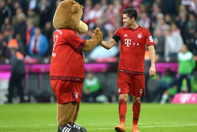 Lewandowski celebrates with Bayern Munich mascot Baerli. Picture: Getty