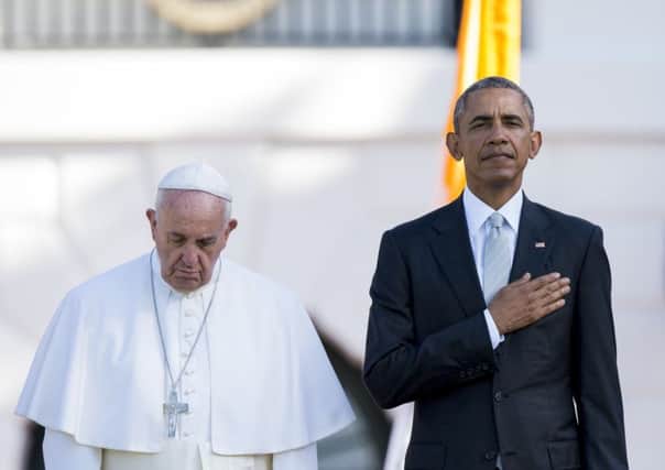 Pope and president side by side on the lawn of the White House. Picture: AFP/Getty