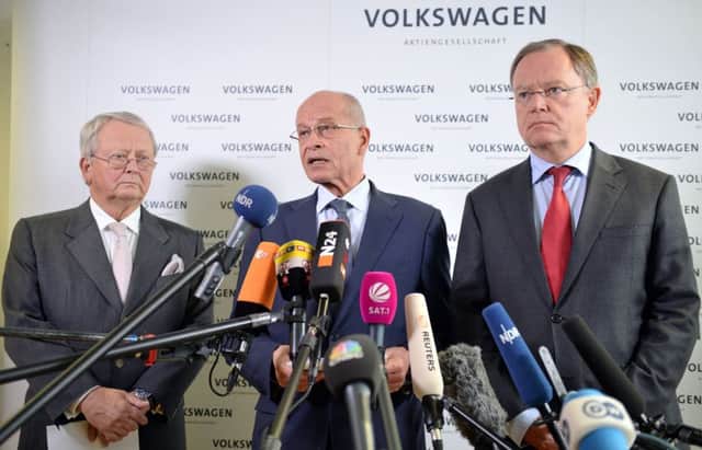 Volkswagen board members give a statement announcing that CEO Martin Winterkorn stepped down. Picture: AP
