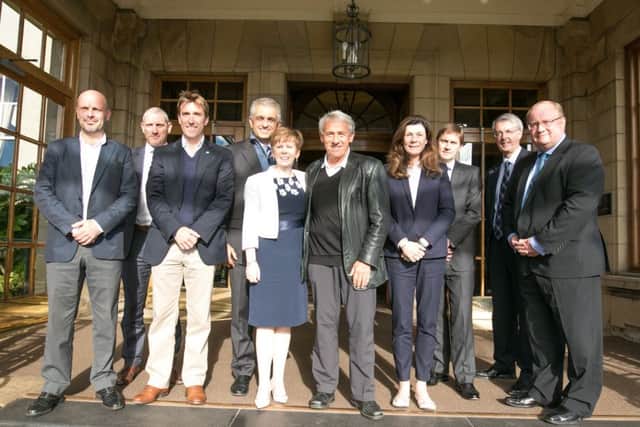 The delegation team line up with representatives from VisitScotland and the Gleneagles resort yesterday. Picture: Stuart Adams