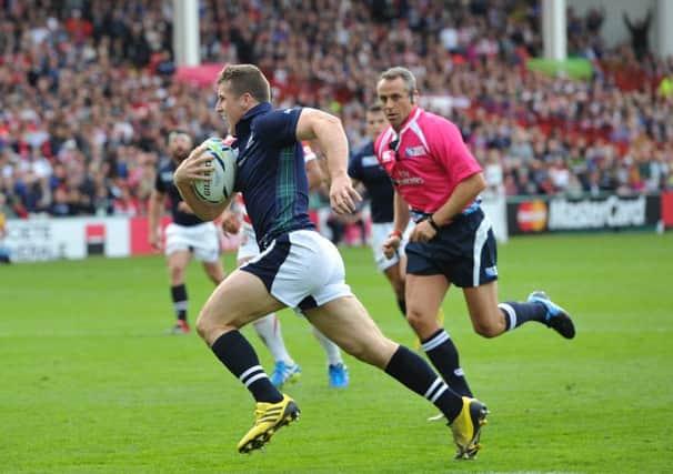 Mark Bennett runs in the first of his two tries against Japan as the Scotland centre produced a stand-out display. Picture: Ian Rutherford