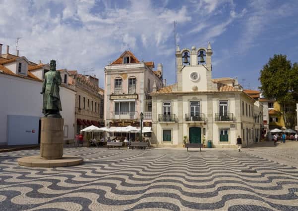Square 5 de Outubro in the center of Cascais, with a famous Portuguese sidewalk made of cobblestone