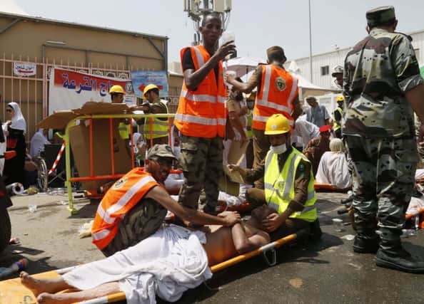 Rescue workers attend to victims of a stampede in Mina, Saudi Arabia during the annual hajj pilgrimage. Picture: AP