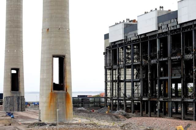 The twin chimneys and turbine hall at Cockenzie Power Station will be demolished tomorrow