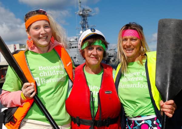 Jenifer Ford, Ann Thomson and Katrina Slater racing for Barnardo's Scotland at the Dragon Boat Race