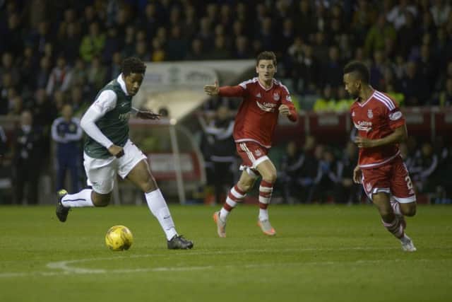 Dominique Malonga weaves his way through the Aberdeen defence to score Hibs second. Picture: SNS