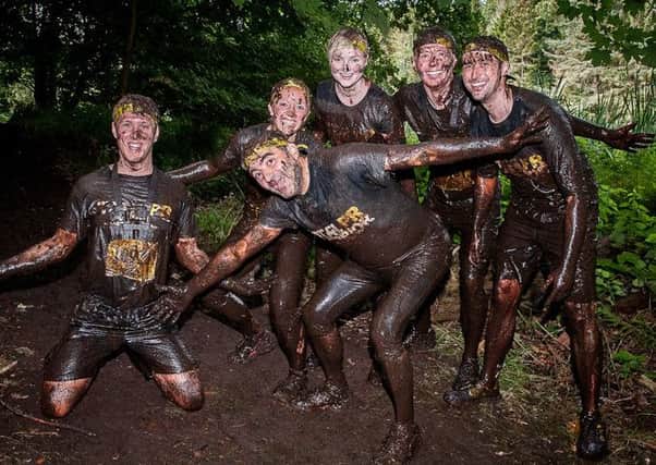 Holyrood PR warriors took to the 12km cross country race; over coming pits of thick mud, fire jumps, and endless climbs. Picture: Wullie Marr
