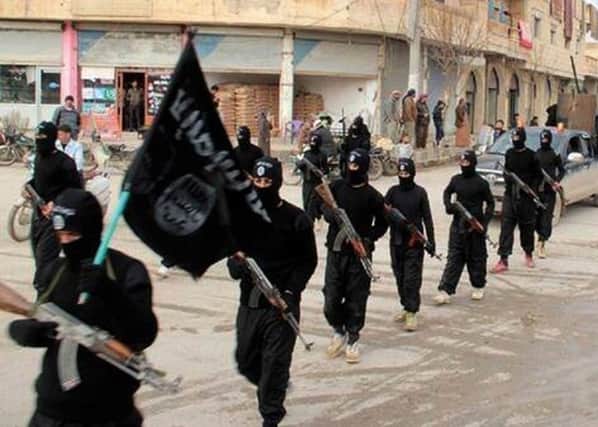 The Islamic State group marching in Raqqa, Syria. Picture: AP