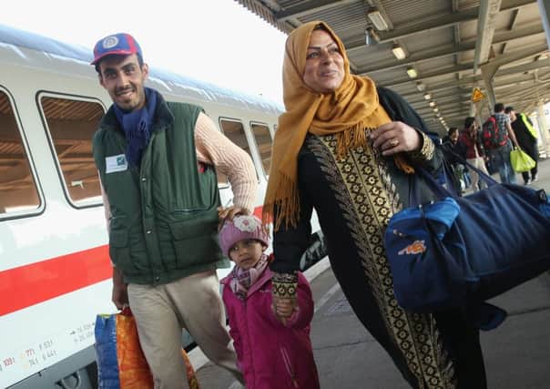 A migrant family disembarks from a government-chartered train in Germany. Picture: Getty Images