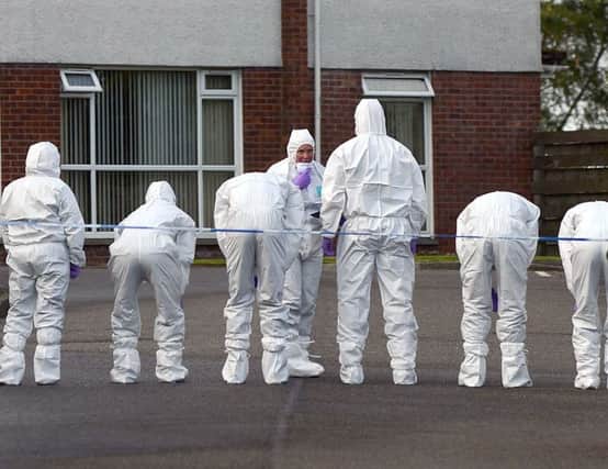 Forensics officers prepare to collect evidence at Dornoch Place, Bishopriggs, yesterday. Picture: Hemedia