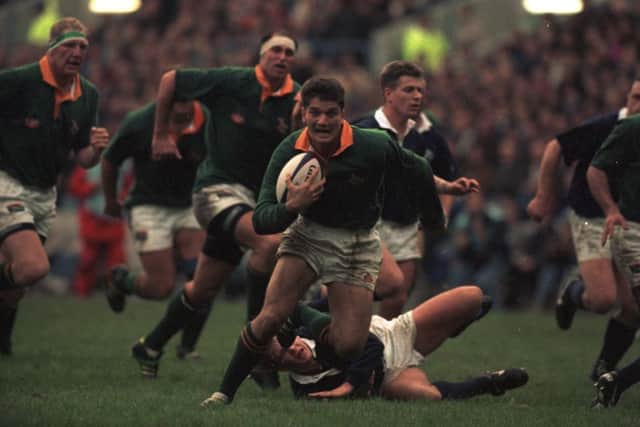 Joost van der Westhuizen, the South African scrumhalf, races through to score against Scotland at Murrayfield. Picture: Hamish Campbell
