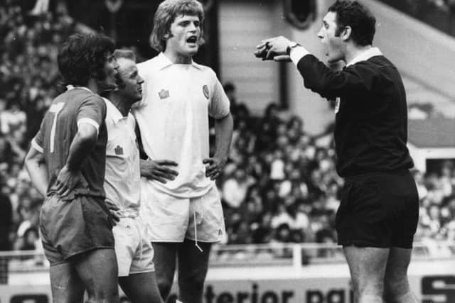 McQueen in the thick of the action as Kevin Keegan and Billy Bremner are sent off in the Charity Shield in 1974. Picture: Getty
