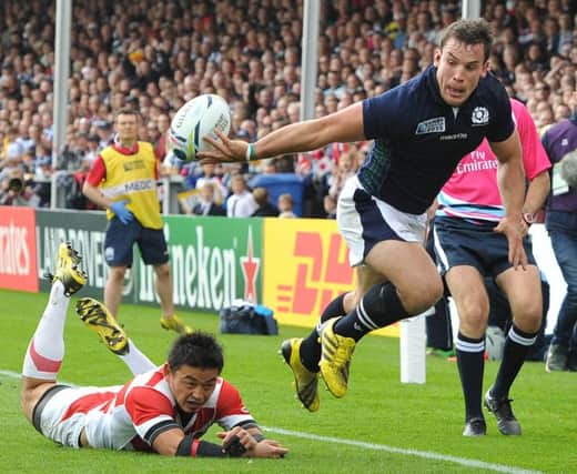 The impressive John Hardie offloads the ball in the buildup to Scotlands first try against Japan. Picture: Ian Rutherford