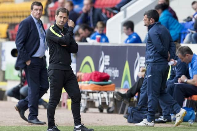 Jackie McNamara, right, cuts a dejected figure as Tommy Wright looks on. Picture: SNS
