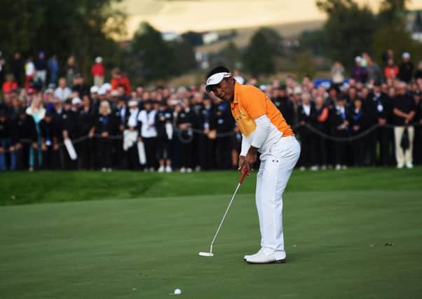 Thongchai Jaidee holes his final putt yesterday to clinch the Porsche European Open in Germany. Picture: Getty Images