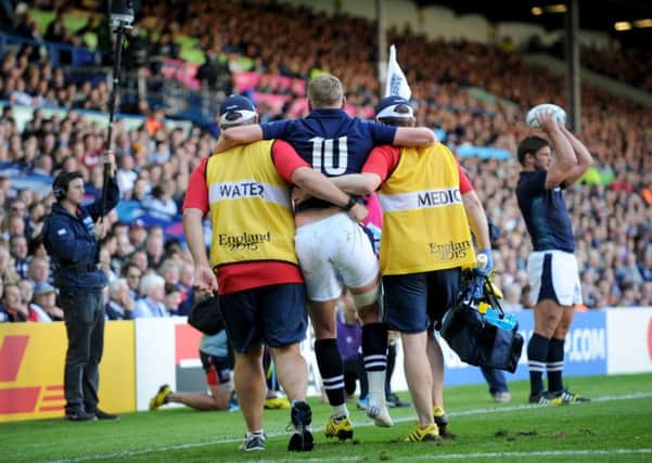 Scotland standoff Finn Russell clutches his ankle. Picture: Ian Rutherford