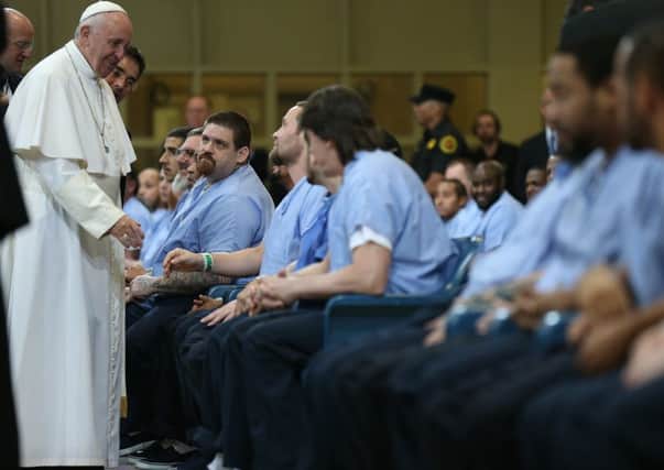 Pope Francis meets and greets inmates of the Curran Fromhold Correctional Centre, a prison serving Pennsylvania, yesterday. Picture:Getty Images