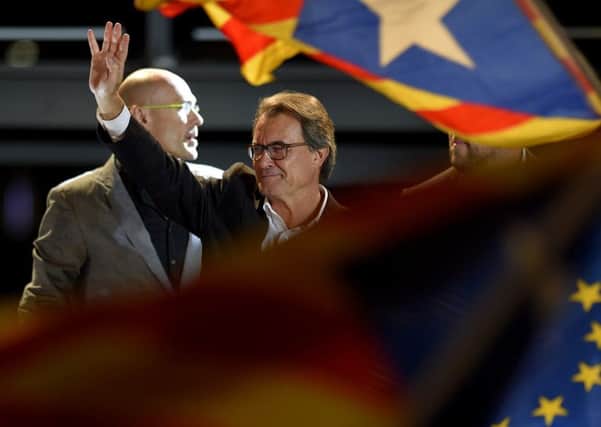 Catalonia's regional president Artur Mas celebrates after the announcement of the results for the regional election in Barcelona. Picture: AFP/Getty Images